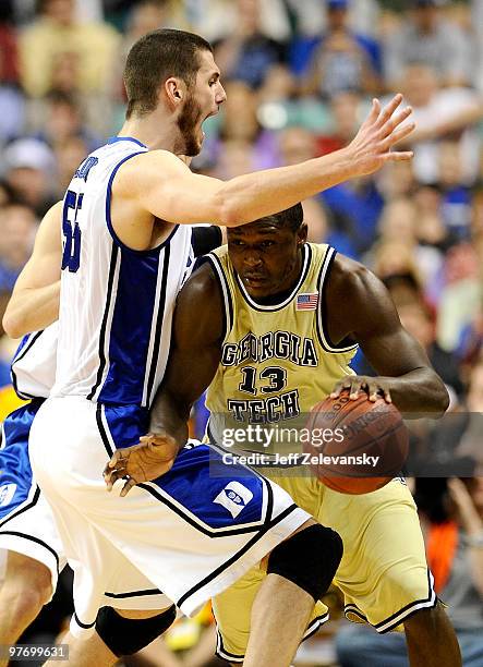 Brian Zoubek of the Duke Blue Devils guards D'Andre Bell of the Georgia Tech Yellow Jackets in the championship game of the 2010 ACC Men's Basketball...