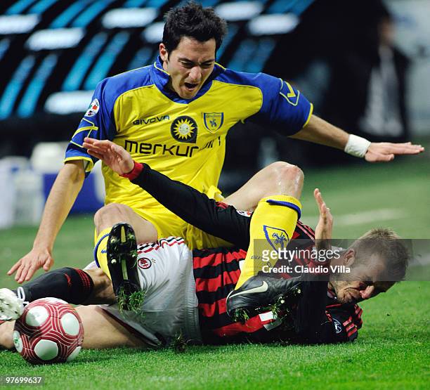 David Beckham of AC Milan competes for the ball with Andrea Mantovani of AC Chievo during the Serie A match between AC Milan and AC Chievo Verona at...