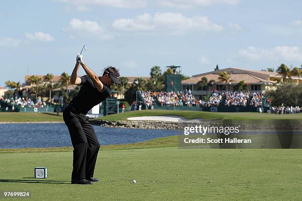 Charl Schwartzel of South Africa tees off on the ninth tee box during the final round of the 2010 WGC-CA Championship at the TPC Blue Monster at...