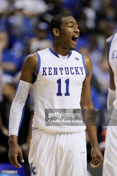 John Wall of the Kentucky Wildcats reacts against the Mississippi State Bulldogs during the final of the SEC Men's Basketball Tournament at the...