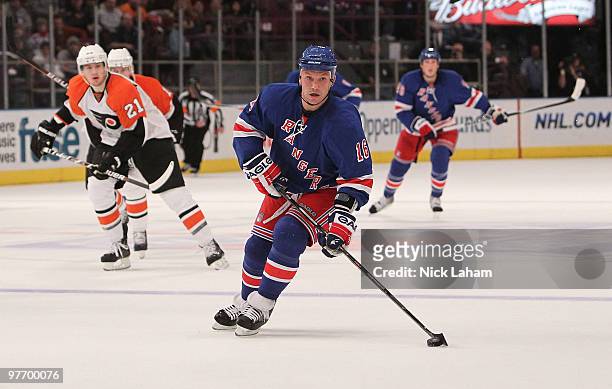 Sean Avery of the New York Rangers skates with the puck against the Philadelphia Flyers at Madison Square Garden on March 14, 2010 in New York City.
