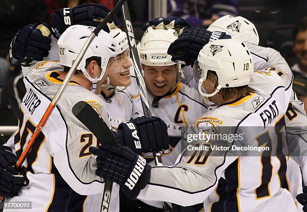 Colin Wilson of the Nashville Predators celebrates his third period eventual game-winning goal with teammates Ryan Suter, captain Jason Arnott, Shea...