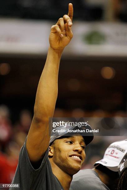 Guard Evan Turner of the Ohio State Buckeyes celebrates after winning the championship game in the Big Ten Men's Basketball Tournament 90-61 over the...