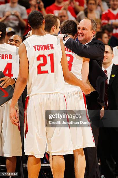 Head coach Thad Matta of the Ohio State Buckeyes celebrates with his starters in the final moments of the championship game in the Big Ten Men's...
