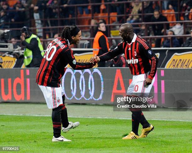 Clarence Seedorf and Ronaldinho of AC Milan celebrate after scoring the goal during the Serie A match between AC Milan and AC Chievo Verona at Stadio...