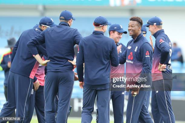 Delray Rawlins of ECB XI celebrates with teammates as he picks up a wicket during a tour match between ECB XI v India A at Headingley on June 17,...