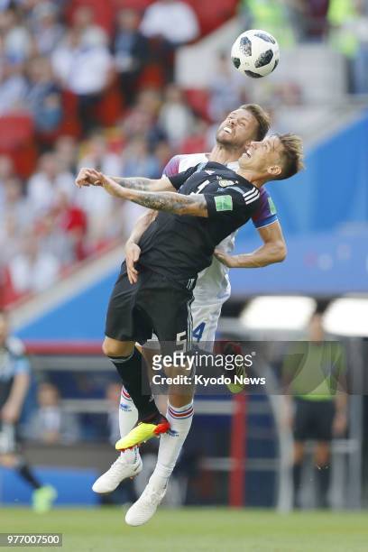 Lucas Biglia of Argentina and Kari Arnason of Iceland vie for the ball during the first half of a 1-1 World Cup group-stage match at Spartak Stadium...