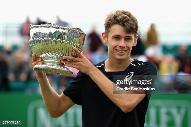 Alex De Minaur of Australia celebrates victory in the Mens Singles Final during Day Nine of the Nature Valley Open at Nottingham Tennis Centre on...