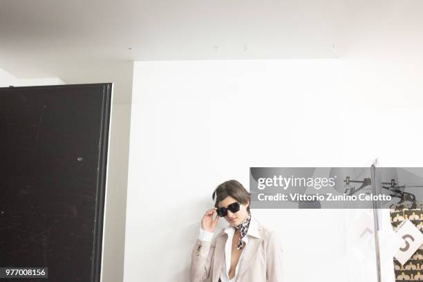 Model is seen backstage ahead of the Daks show during Milan Men's Fashion Week Spring/Summer 2019 on June 17, 2018 in Milan, Italy.