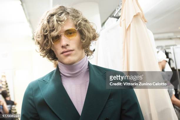 Model is seen backstage ahead of the Daks show during Milan Men's Fashion Week Spring/Summer 2019 on June 17, 2018 in Milan, Italy.