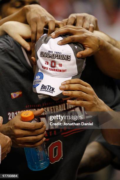 Guard Evan Turner of the Ohio State Buckeyes is congratulated by his teammates after being named the Big Ten Men's Basketball Tournament MVP...