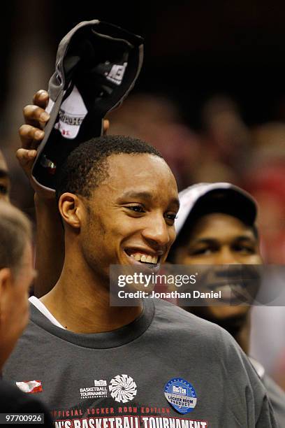 Guard Evan Turner of the Ohio State Buckeyes smiles after being named the Big Ten Men's Basketball Tournament MVP following the championship game at...