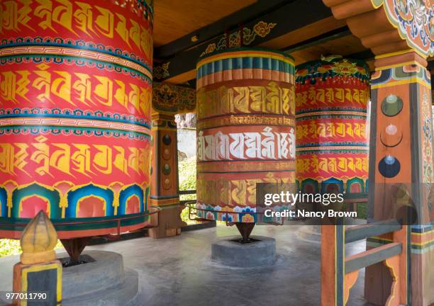 prayer wheels in kyichhu temple in bhutan. - circa 7th century - fotografias e filmes do acervo