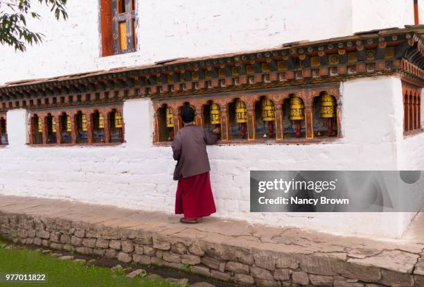 bhutanese woman in kyichhu temple in bhutan. - paro district fotografías e imágenes de stock