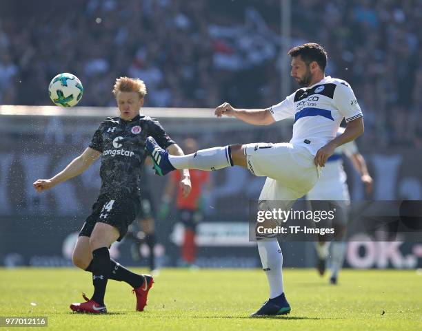 Mats Möller Daehli of St. Pauli and Stephan Salger battle for the ball during the Second Bundesliga match between FC St. Pauli and DSC Arminia...