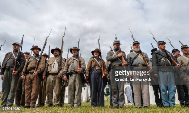 Re-enactors representing Confederate soldiers in the American Civil War practice their rifle drill during the Frontline Sedgefield living history...