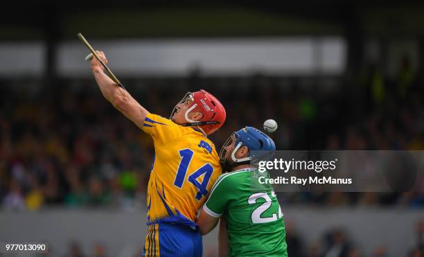 Ennis , Ireland - 17 June 2018; John Conlon of Clare and Richie McCarthy of Limerick both miss catching the sliothar during the Munster GAA Hurling...