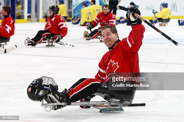 Todd Nicholson of Canada celebrates their 10-1 victory over Sweden during the Ice Sledge Hockey Preliminary Round Group B Game between Canada and...