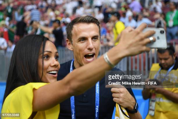 Phil Neville a Former England International now Women's national coach and TV commentator poses for a selfie with tv football commentator Alex Scott...