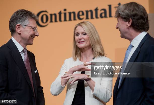 April 2018, Germany, Hannover: Elmar Degenhart, CEO of Continental AG , Ariane Reinhart, Personnel Director, and Wolfgang Schaefer, CFO, at the...