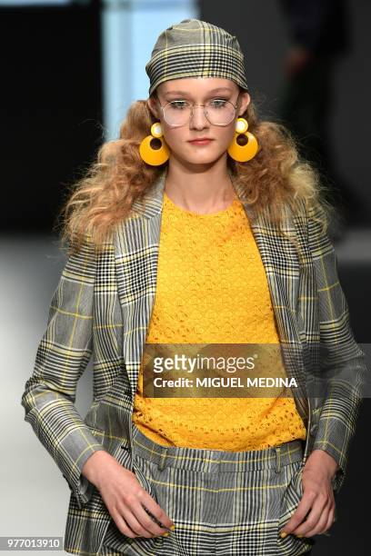Model presents a creation by DAKS during the men & women's spring/summer 2019 collection fashion show in Milan, on June 17, 2018.
