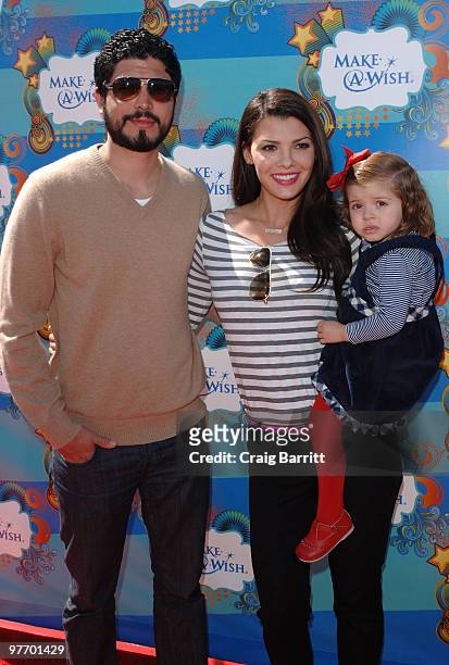 Ali Landry arrive at the Make A Wish Foundation event hosted by Kevin and Steffiana James at Santa Monica Pier on March 14, 2010 in Santa Monica,...