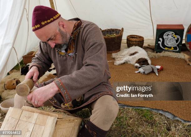 Carpenter works ouside his tent as he depicts life as a Viking during the Frontline Sedgefield living history event on June 17, 2018 in Durham,...