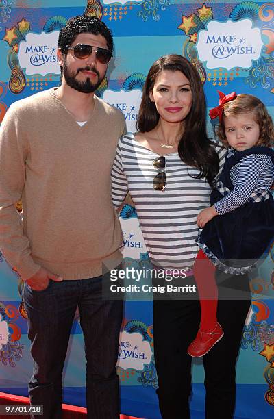 Ali Landry arrive at the Make A Wish Foundation event hosted by Kevin and Steffiana James at Santa Monica Pier on March 14, 2010 in Santa Monica,...