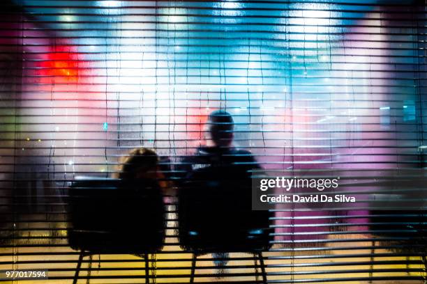 silhouettes of people sitting on chairs, paris, france - jalousie fotografías e imágenes de stock