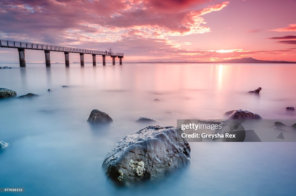 Seascape and Rangitoto Island at sunset, Murrays Bay, Auckland, New Zeland