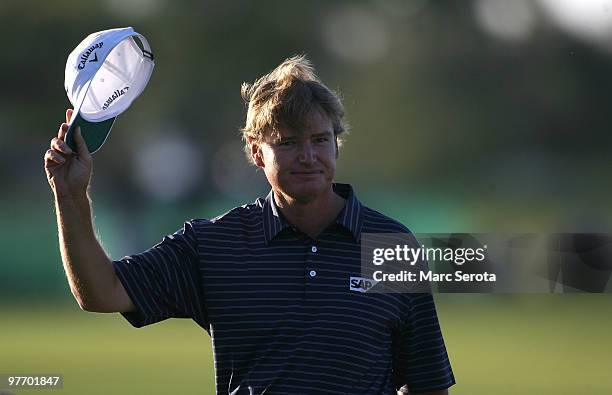 Ernie Els of South Africa waves to the gallery after winning the final round of the 2010 WGC-CA Championship at the TPC Blue Monster at Doral on...