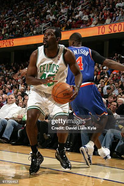 Michael Finley of the Boston Celtics sets up for the shot after faking out defended Antawn Jamison of the Cleveland Cavaliers on March 14, 2010 at...