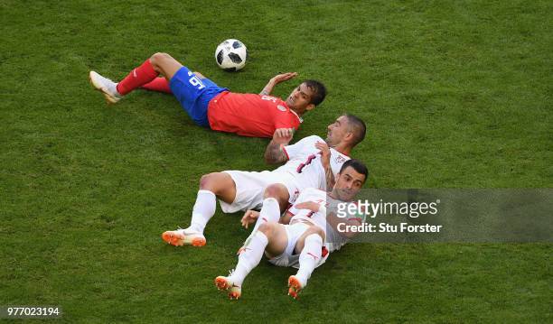 Cristian Gamboa of Costa Rica is challenged by Aleksander Kolarov and Fiilip Kostic of Serbia during the 2018 FIFA World Cup Russia group E match...