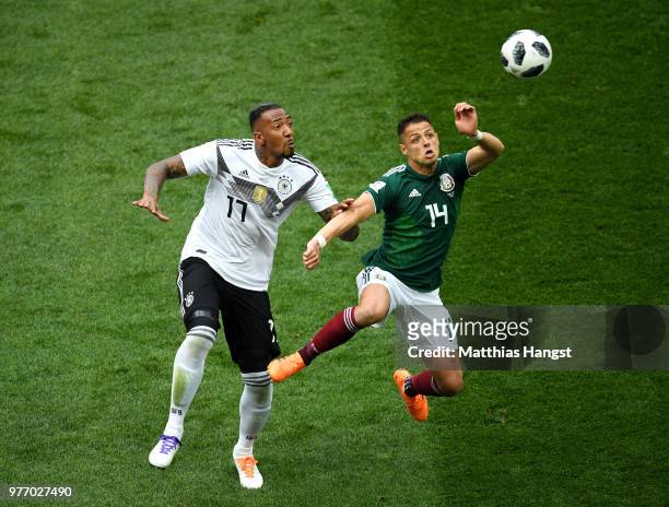 Jerome Boateng of Germany and Javier Hernandez of Mexico compete for the ball in the air during the 2018 FIFA World Cup Russia group F match between...