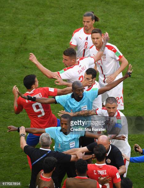 Referee Malang Diedhiou steps in to seperate Serbia player Nemanja Matic from the Costa Rica bench during the 2018 FIFA World Cup Russia group E...