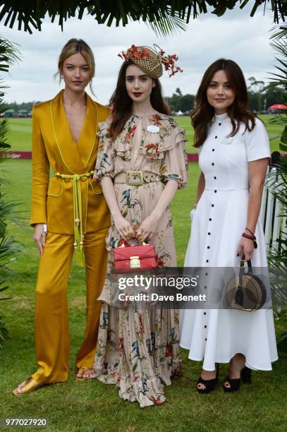 Martha Hunt, Lily Collins and Jenna Coleman attend the Cartier Queen's Cup Polo Final at Guards Polo Club on June 17, 2018 in Egham, England.