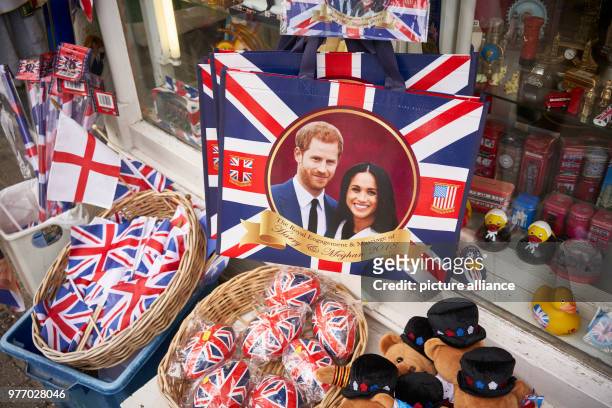 April 2018, Britain, Windsor: Souvenir articles showing prince harry and Meghan Markle for sale in a shop. Prince Harry and the American actress...