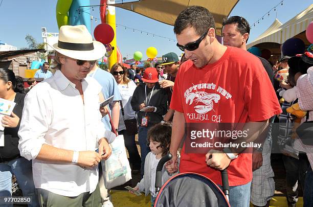 Actor/comedians David Spade and Adam Sandler attend the Make-A-Wish Foundation's Day of Fun hosted by Kevin & Steffiana James held at Santa Monica...