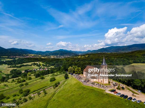 aerial view of church saint-gilles in saint-pierre-bois, alsace, france - architecture bois stock pictures, royalty-free photos & images