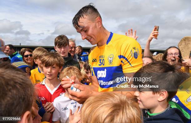 Ennis , Ireland - 17 June 2018; Peter Duggan of Clare is surrounded by autograph hunters after the Munster GAA Hurling Senior Championship Round 5...