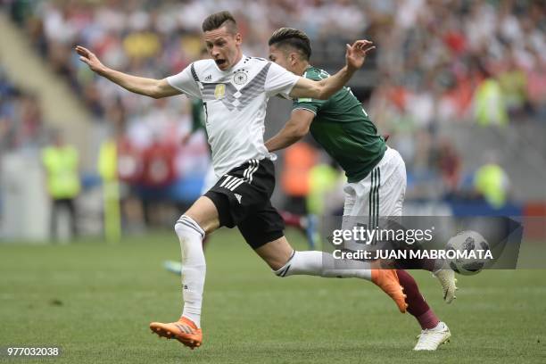 Germany's forward Julian Draxler vies for the ball with Mexico's defender Carlos Salcedo during the Russia 2018 World Cup Group F football match...