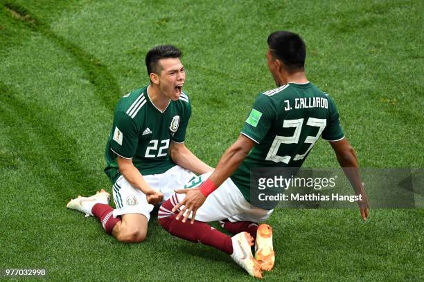 Hirving Lozano of Mexico celebrates with Jesus Gallardo by sliding on their knees after scoring his team's first goal during the 2018 FIFA World Cup...