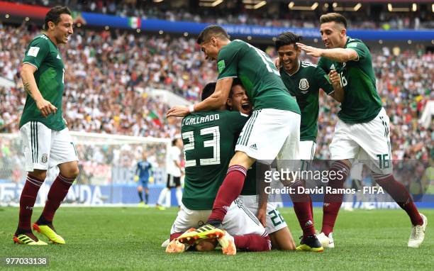 Hirving Lozano of Mexico celebrates with teammates by sliding on his knees after scoring his team's first goal during the 2018 FIFA World Cup Russia...