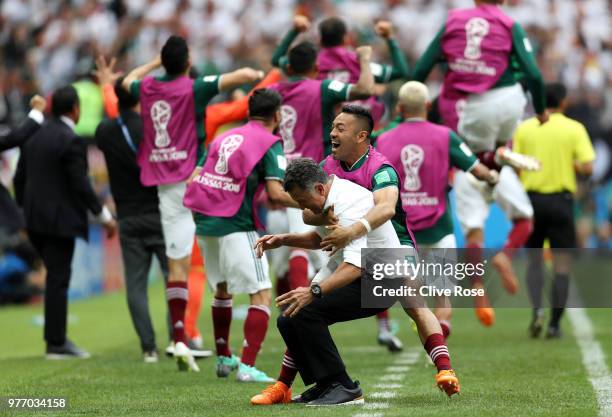 Juan Carlos Osorio, Manager of Mexico celebrates with Marco Fabian of Mexico after their sides first goal during the 2018 FIFA World Cup Russia group...