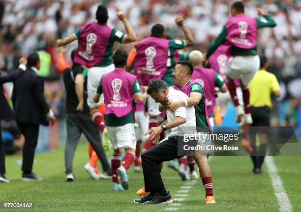 Juan Carlos Osorio, Manager of Mexico celebrates with Marco Fabian of Mexico after their sides first goal during the 2018 FIFA World Cup Russia group...