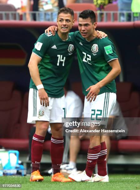 Hirving Lozano of Mexico celebrates with team mate Javier Hernandez of Mexico after scoring his team's first goal during the 2018 FIFA World Cup...