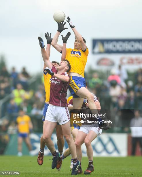 Roscommon , Ireland - 17 June 2018; Cathal Compton of Roscommon claims possession ahead of Thomas Flynn of Galway during the Connacht GAA Football...