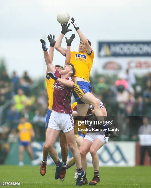 Roscommon , Ireland - 17 June 2018; Cathal Compton of Roscommon claims possession ahead of Thomas Flynn of Galway during the Connacht GAA Football...