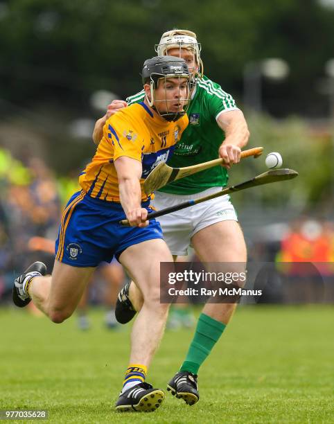 Ennis , Ireland - 17 June 2018; Tony Kelly of Clare in action against Cian Lynch of Limerick during the Munster GAA Hurling Senior Championship Round...