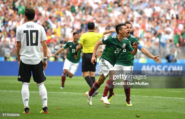 Hirving Lozano of Mexico celebrates with team mate Andres Guardado of Mexico after scoring his team's first goal during the 2018 FIFA World Cup...